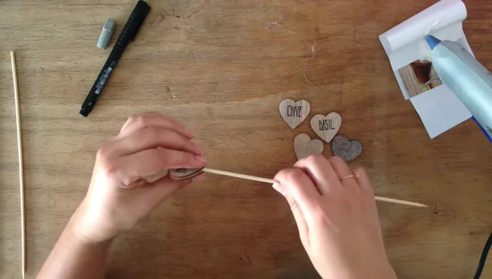 Hold the stick in place until the glue dries to ensure proper adhesion.