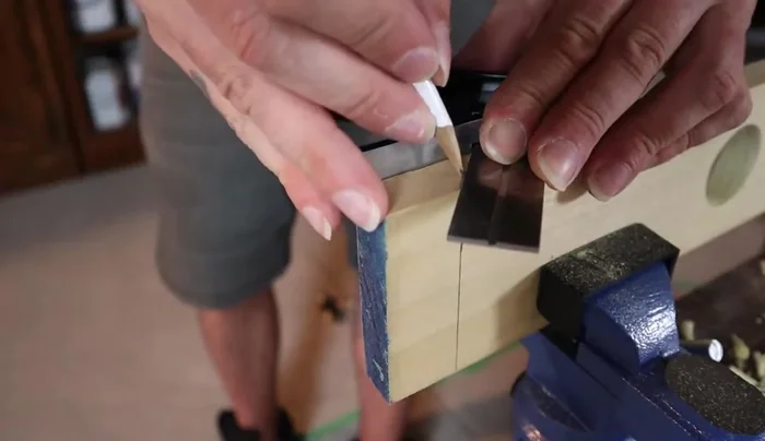 Carefully cut along the 45-degree angle lines to create the angled end.