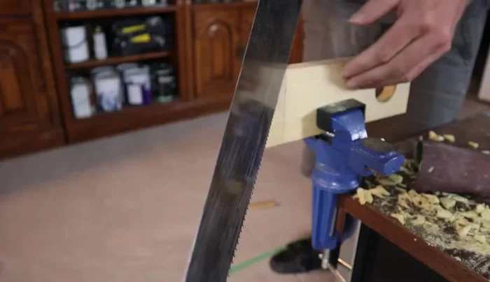 Carefully cut along the 45-degree angle lines to create the angled end.