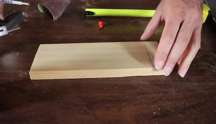 Drill a hole using a Forstner bit (1.25 to 1.625 inches in diameter) at the marked center point.