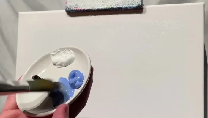 Add titanium white and light blue violet to the bottom (beach area) and top of the sky, blending gently.