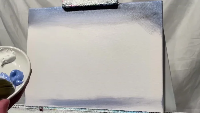 Add titanium white and light blue violet to the bottom (beach area) and top of the sky, blending gently.