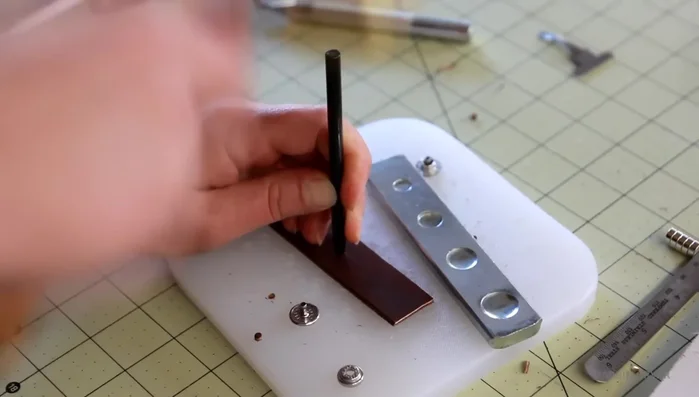 Prepare clasp using riveted snap & metal plate; add loop for security.