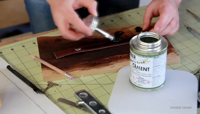 Punch holes through both layers; sew with contrasting hemp thread.