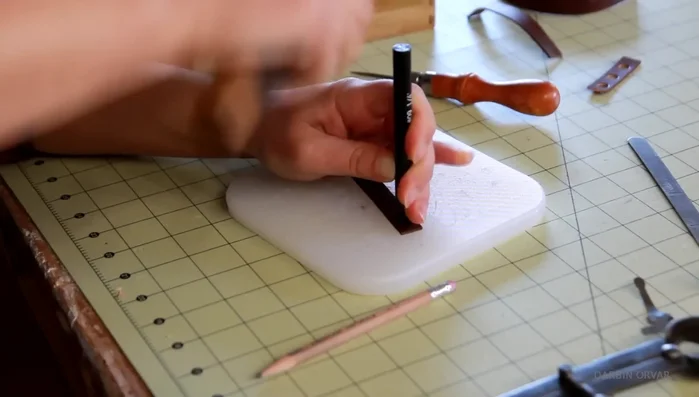 Place magnets on narrow strip; punch holes (may require enlarging for magnet fit).