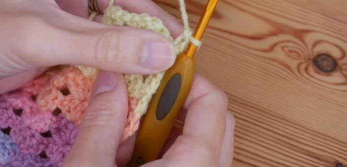 To create a straight edge, work a treble height stitch, chain two, then a double crochet (or US single crochet), chain three, and repeat across the row.