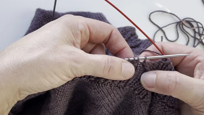 Prepare for the Italian bind-off by ensuring the last row before binding off has a purl stitch next to the center stitch.