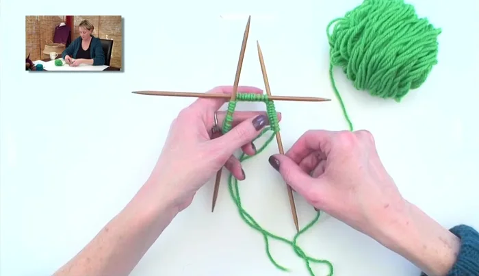 Keep everything on the table to avoid twisting until the initial stitch is secured. Then, you can pick it up.
