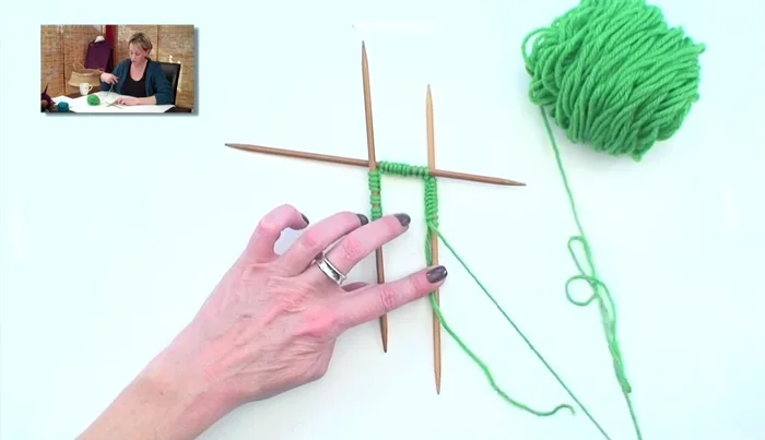 Keep everything on the table to avoid twisting until the initial stitch is secured. Then, you can pick it up.
