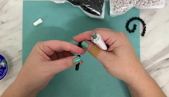 Let it Dry: Allow the glue to dry completely to secure the knot.