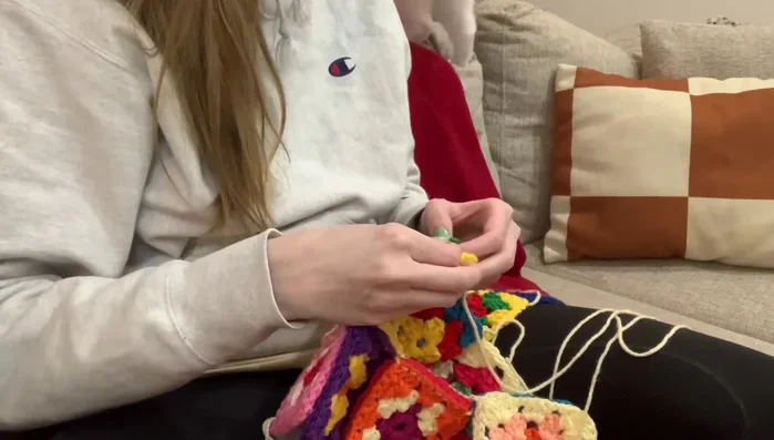 Join all the pairs together using a blanket stitch with a contrasting color of yarn.