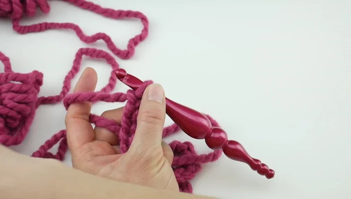 Row 1: In the fourth chain from the hook, work two double crochets. Skip two chains, work a single crochet in the next chain. Repeat the pattern of four double crochets, skip two chains, work a single crochet across the row.