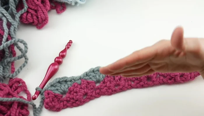 Repeat Row 2 until the piece reaches the desired height for your pillow cover (allowing for overlap at the top and bottom). For a 12-inch pillow, approximately 28 inches in length was used in the video.