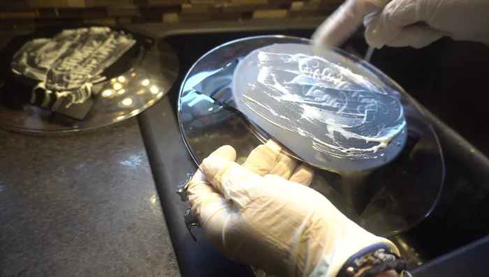 Rinse the plate thoroughly with warm water to remove any remaining Armor Etch. Carefully peel off any remaining vinyl.