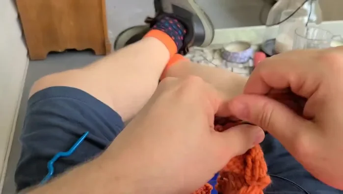 Continue knitting until the piece measures 17 inches.