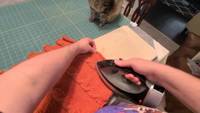 Lightly steam the knitted piece to flatten it.