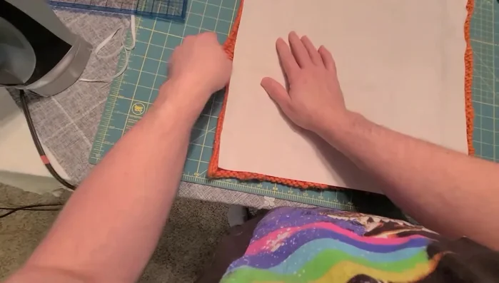 Sew around three sides using a wide stitch and reduced pressure on the presser foot.