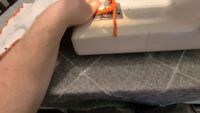 Sew around three sides using a wide stitch and reduced pressure on the presser foot.