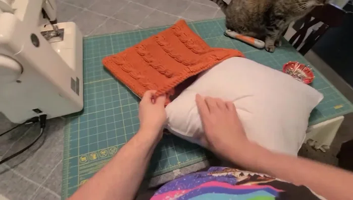 Hand-stitch the open end closed, using a needle and thread matching the backing fabric.