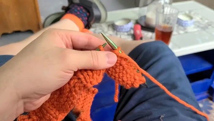 Continue knitting until the piece measures 17 inches.