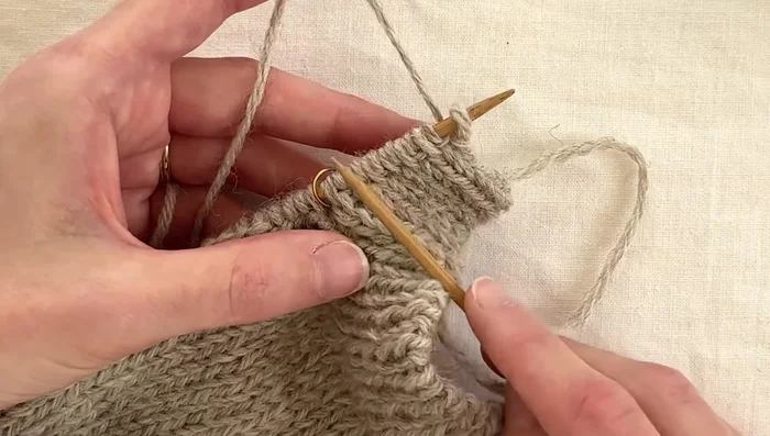 Work buttonholes: To create a buttonhole, work the right-hand stitches for a few rows, then jump to the left-hand stitches and work those for a few rows, creating a vertical slice.