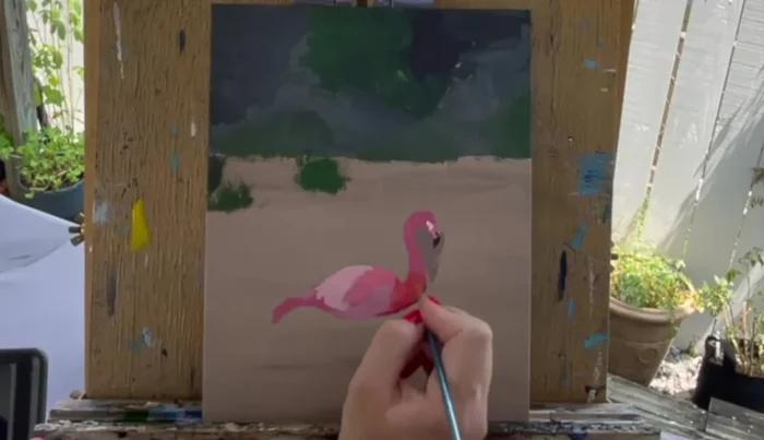 Create a purple and red wash by mixing a little water into these colors and outline the underside of the wing and tail feathers.