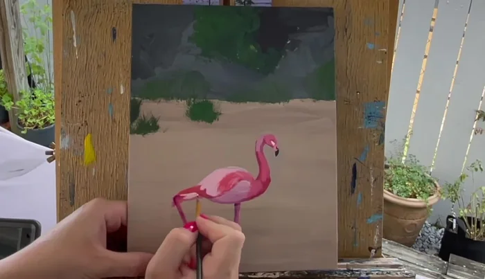 Use light pink for the lower leg and part of the tail feathers. Add details to back feathers using medium pink.