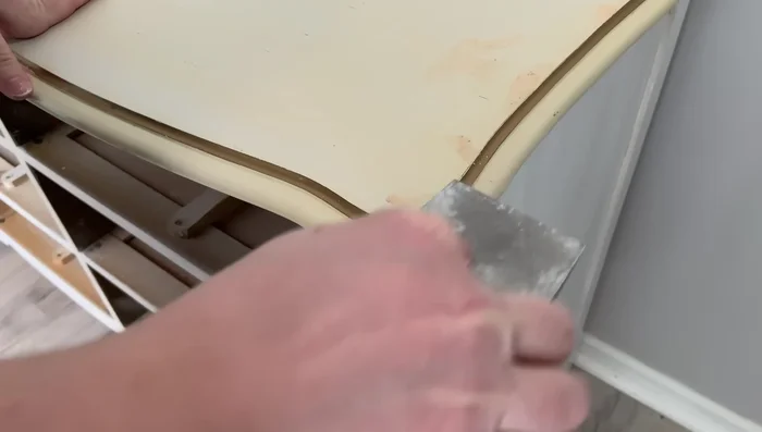 Sand down any excess wood filler.