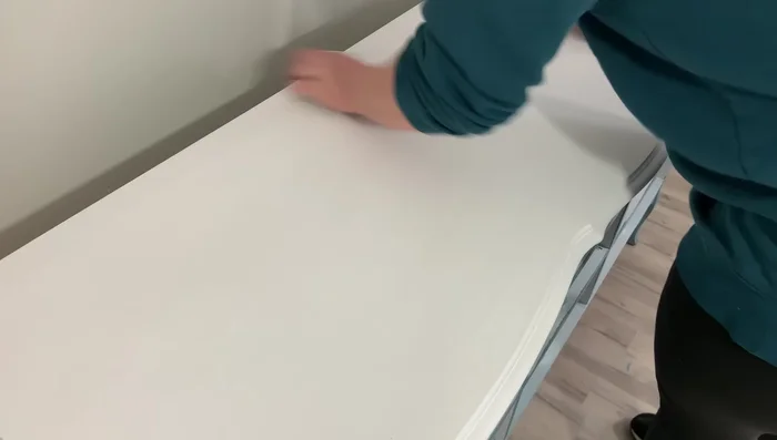 Whitewash the top using Rust-Oleum Chalked Paint in White Linen, diluted with water. Apply multiple thin layers for the desired level of distressing. Use a lint-free cloth to remove excess paint for a smooth, uniform look.