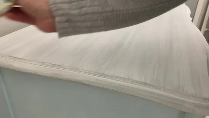 Attach the hardware to the finished dresser.