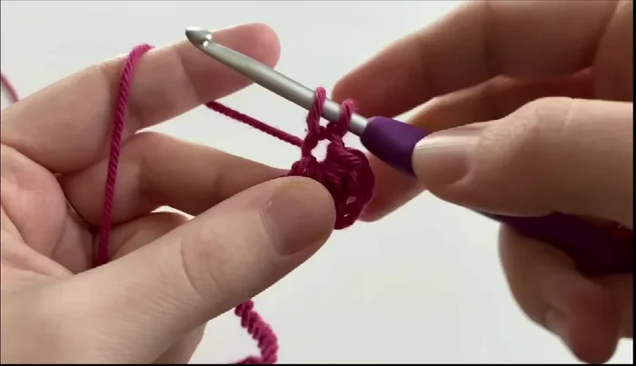 Repeat step 5 until you have six loops, then yarn over and pull through all six loops and chain one to finish the star stitch.