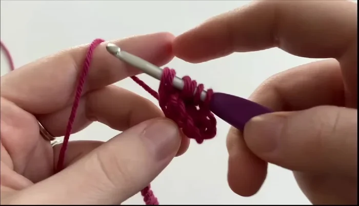 Repeat step 5 until you have six loops, then yarn over and pull through all six loops and chain one to finish the star stitch.