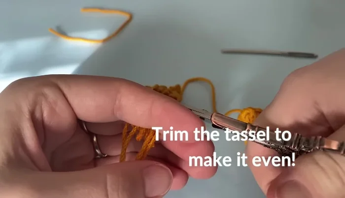 Block the bookmark: Use straight pins to stretch the bookmark, making it straight. Use a spray bottle or steamer to dampen the fabric, keeping the steamer 1-2 inches away. Gently pat the water or steam into the fabric. Remove pins once dry.