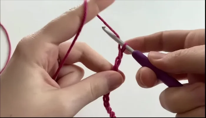 Repeat step 5 until you have six loops, then yarn over and pull through all six loops and chain one to finish the star stitch.