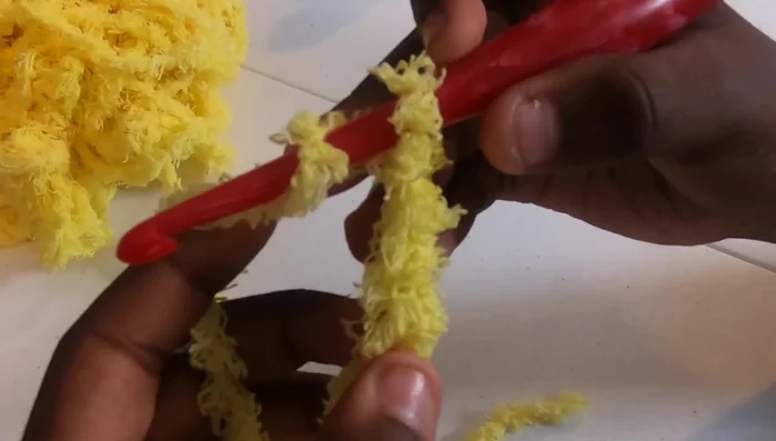 Work your first block: Double crochet (dc) in the 4th chain from the hook (the loop on the hook doesn't count). Then, dc in the next chain space.