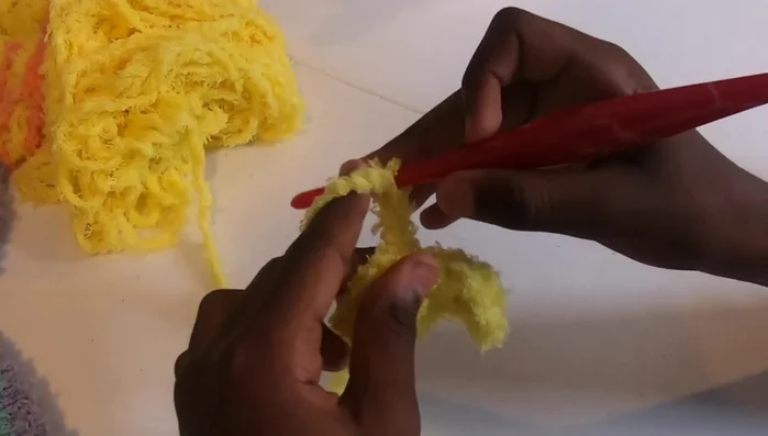 Repeat step 6, increasing the number of blocks in each row until your blanket reaches your desired width (approximately 37 inches in the video).