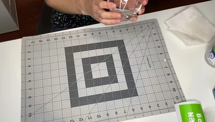 Use a dry erase marker to trace the waterline on the glass to aid in stencil placement.