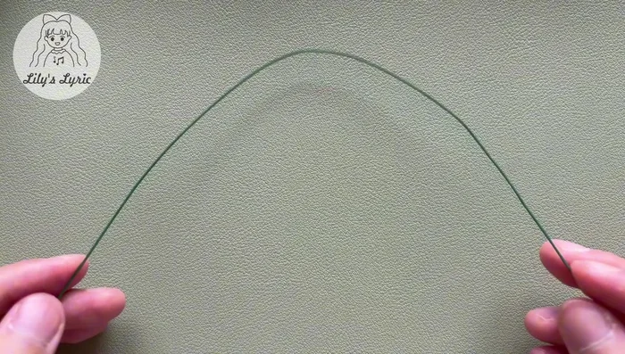 Make a slip stitch, work back into the last chain and make another single crochet. Work into stitches on the other side: half double crochet, 16 double crochets, half double crochet, and single crochet. Slip stitch in the first stitch to fasten off. Weave in the yarn ends.