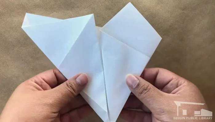 Cut along the front edge of the three large panels to form a pentagon.