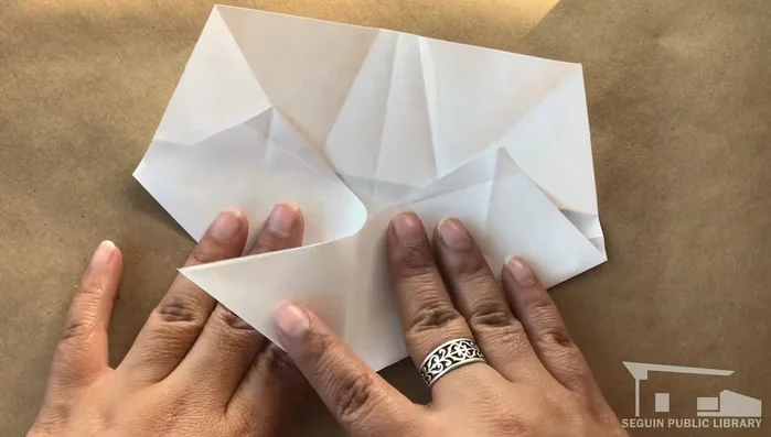 Repeat step 12 on each remaining point, folding clockwise.