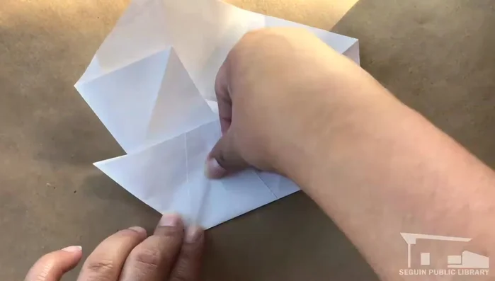 Repeat step 12 on each remaining point, folding clockwise.