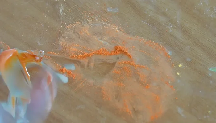 Add greasy effect to the pizza using a mix of leftover pastels and translucent liquid Sculpey.