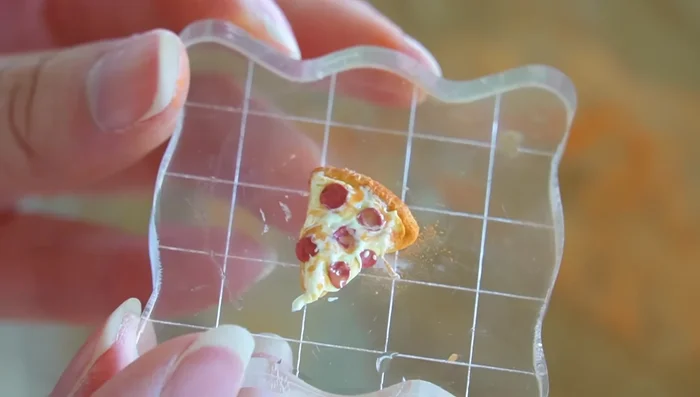 Add finishing touches to the pizza, texturing the crust.