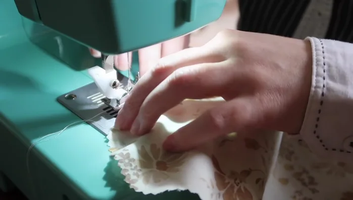 Create ruffles for the heart pocket, similar to the bodice ruffles, and attach to the pocket.