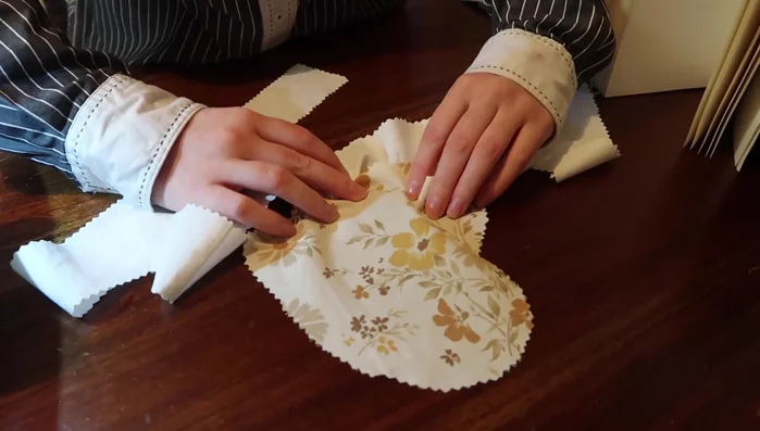 Create ruffles for the heart pocket, similar to the bodice ruffles, and attach to the pocket.