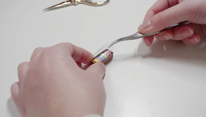 Optional: Add a plastic lid to the macaron box using leftover plastic.