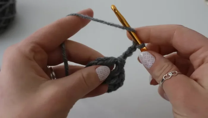 Continue this pattern of single crochet and seven double crochets around.