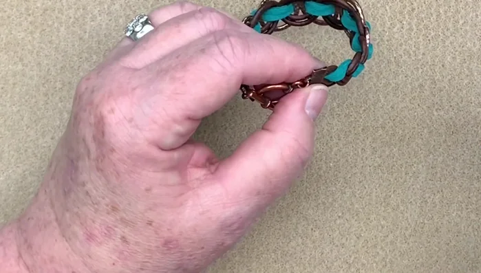 Add a small amount of Loctite glue to secure the jump rings and ribbon ends.