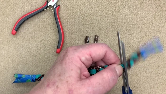 Add a small amount of Loctite glue to secure the jump rings and ribbon ends.