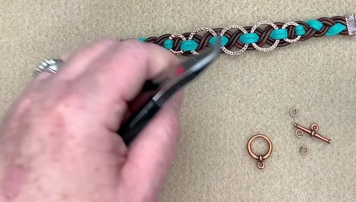 Attach the toggle clasp using jump rings.